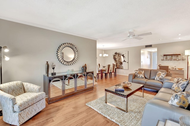 14699 Canalview C Dr Unit C, Delray Beach, FL 33484 - living room featuring a ceiling fan, light wood-type flooring, a chandelier, crown molding, and baseboards