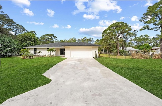 15763 Alexander Run, Jupiter, FL 33478 - ranch-style home featuring driveway, a front yard, a garage, and stucco siding