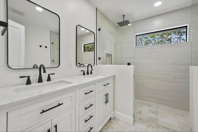 15763 Alexander Run, Jupiter, FL 33478 - bathroom featuring marble finish flooring, a walk in shower, double vanity, and recessed lighting