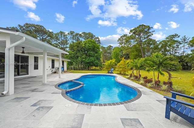 15763 Alexander Run, Jupiter, FL 33478 - view of pool with a patio, ceiling fan, a pool with connected hot tub, and view of wooded area