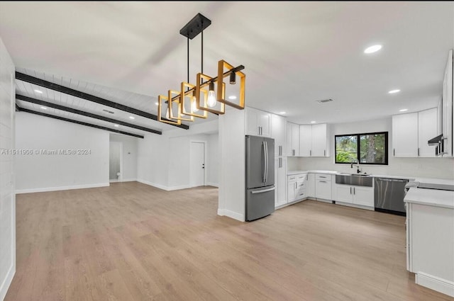15763 Alexander Run, Jupiter, FL 33478 - kitchen with stainless steel appliances, a sink, open floor plan, light countertops, and light wood-style floors