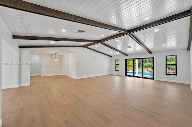 15763 Alexander Run, Jupiter, FL 33478 - unfurnished living room featuring recessed lighting, beam ceiling, light wood-style flooring, and baseboards