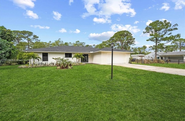 15763 Alexander Run, Jupiter, FL 33478 - ranch-style home with driveway, an attached garage, a front yard, and stucco siding