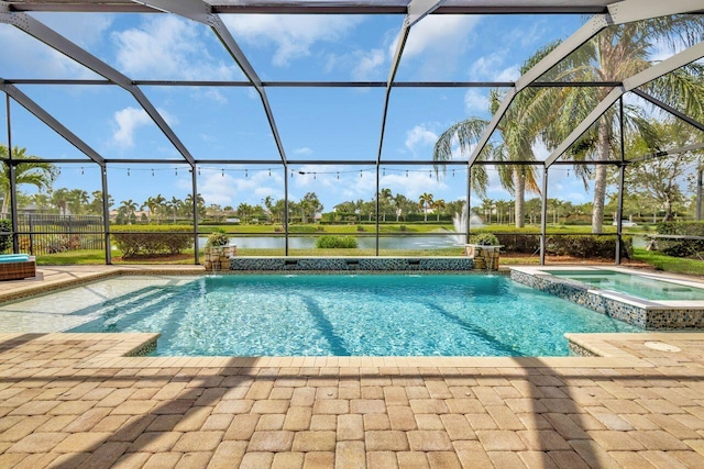 420 SE Bancroft Ct, Port Saint Lucie, FL 34984 - view of swimming pool with a water view, a pool with connected hot tub, glass enclosure, and a patio area