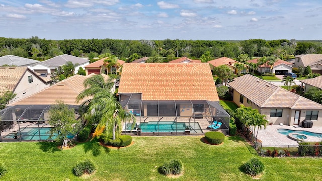 drone / aerial view with a water view and a residential view