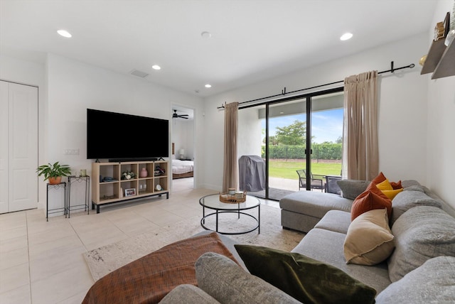 16390 Sea Turtle Pl, The Acreage, FL 33470 - living room with recessed lighting, visible vents, and light tile patterned floors
