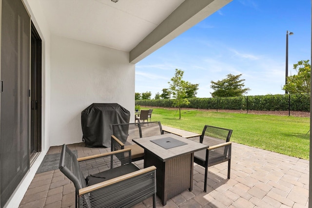 16390 Sea Turtle Pl, The Acreage, FL 33470 - view of patio with a fenced backyard, outdoor dining space, and area for grilling