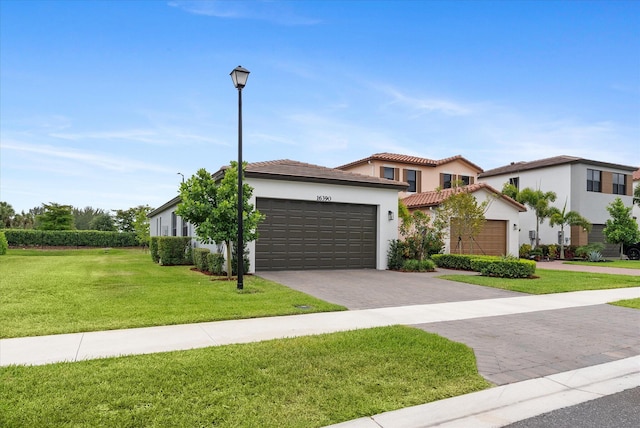16390 Sea Turtle Pl, The Acreage, FL 33470 - view of front of property with stucco siding, a tile roof, driveway, a front yard, and a garage