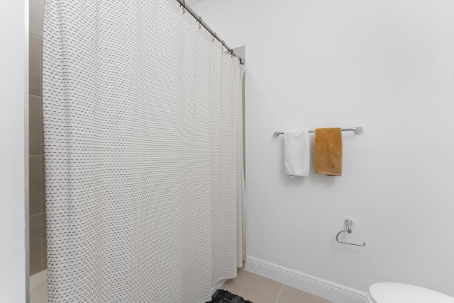 16390 Sea Turtle Pl, The Acreage, FL 33470 - full bath with baseboards, tile patterned flooring, a shower with shower curtain, and toilet