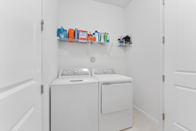16390 Sea Turtle Pl, The Acreage, FL 33470 - clothes washing area featuring independent washer and dryer, laundry area, and light tile patterned floors