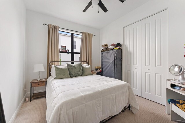 16390 Sea Turtle Pl, The Acreage, FL 33470 - bedroom featuring light carpet, a ceiling fan, and a closet