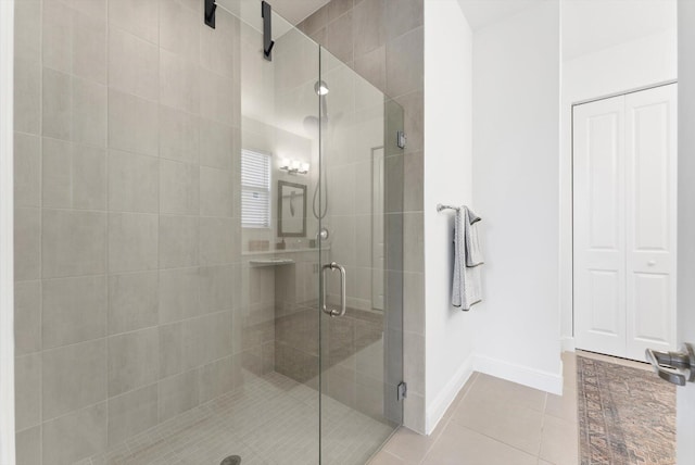 16390 Sea Turtle Pl, The Acreage, FL 33470 - bathroom featuring a shower stall, baseboards, and tile patterned floors