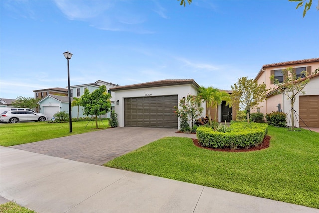 16390 Sea Turtle Pl, The Acreage, FL 33470 - view of front of home with stucco siding, driveway, a front yard, and a garage