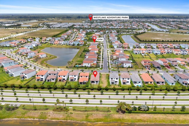 16390 Sea Turtle Pl, The Acreage, FL 33470 - bird's eye view with a water view and a residential view