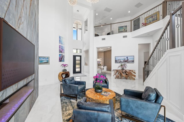 2560 NW 70th Blvd, Boca Raton, FL 33496 - living room with stairway, ornamental molding, baseboards, visible vents, and a high ceiling