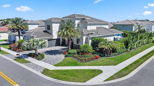 2560 NW 70th Blvd, Boca Raton, FL 33496 - view of front of property featuring stucco siding, decorative driveway, a residential view, and a tile roof