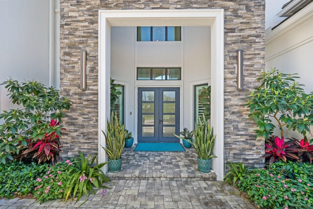 2560 NW 70th Blvd, Boca Raton, FL 33496 - property entrance featuring french doors and brick siding