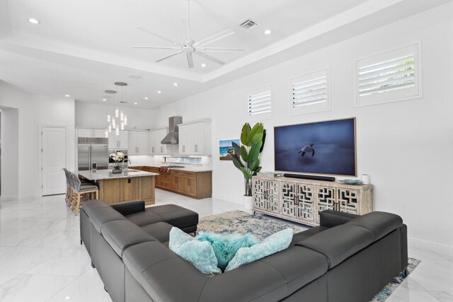 2560 NW 70th Blvd, Boca Raton, FL 33496 - living area featuring recessed lighting, ceiling fan, marble finish floor, baseboards, and a towering ceiling
