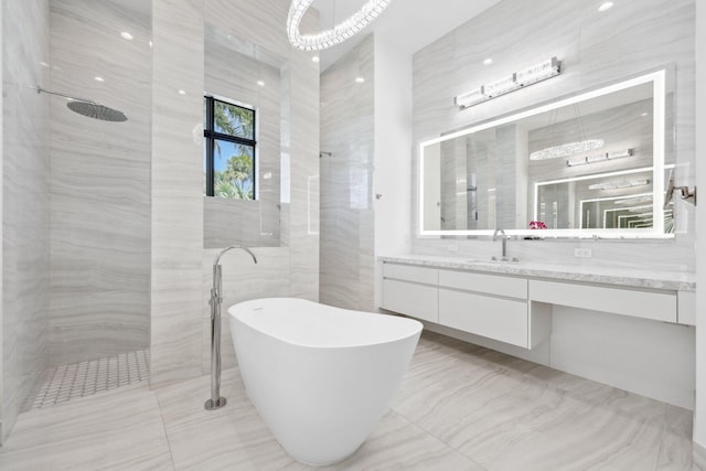 2560 NW 70th Blvd, Boca Raton, FL 33496 - full bathroom with tile walls, a freestanding bath, a walk in shower, and vanity