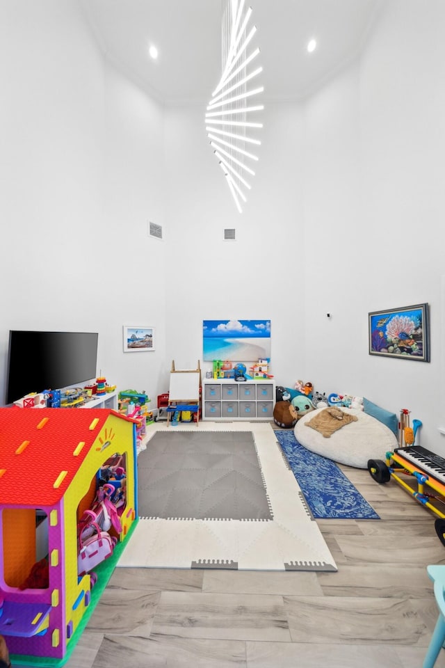 2560 NW 70th Blvd, Boca Raton, FL 33496 - rec room with a towering ceiling, visible vents, and recessed lighting