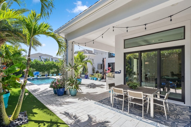 2560 NW 70th Blvd, Boca Raton, FL 33496 - view of patio featuring outdoor dining space and an outdoor pool