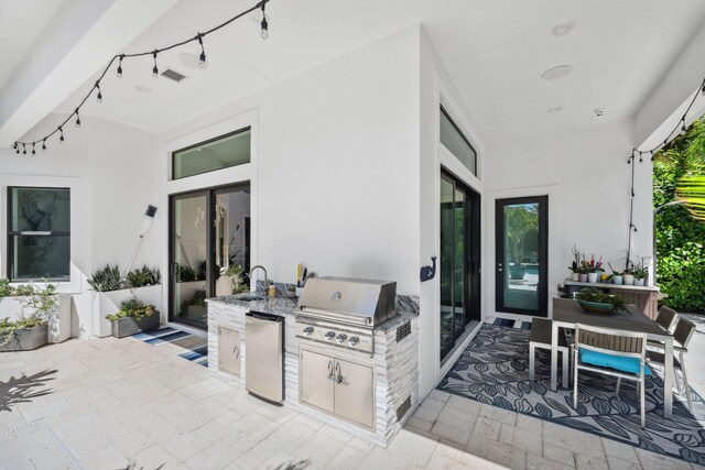 2560 NW 70th Blvd, Boca Raton, FL 33496 - view of patio / terrace with an outdoor kitchen, visible vents, a sink, french doors, and a grill