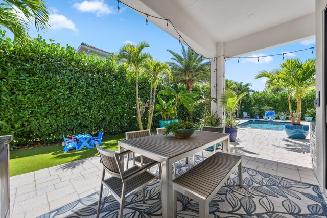 2560 NW 70th Blvd, Boca Raton, FL 33496 - view of patio / terrace with outdoor dining area and an outdoor pool