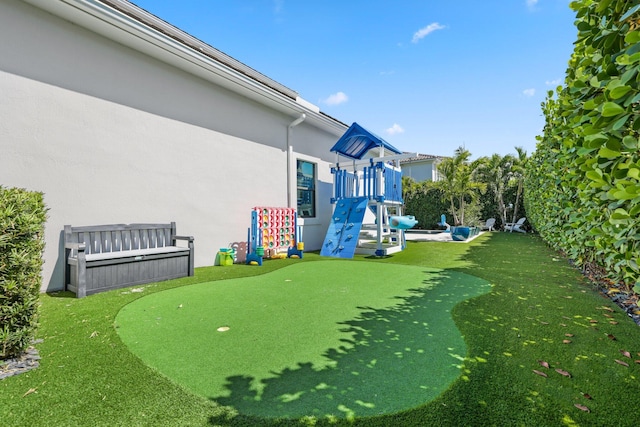 2560 NW 70th Blvd, Boca Raton, FL 33496 - view of yard with a playground