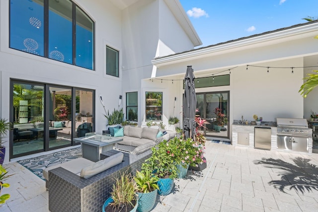 2560 NW 70th Blvd, Boca Raton, FL 33496 - view of patio featuring area for grilling, an outdoor hangout area, and an outdoor kitchen