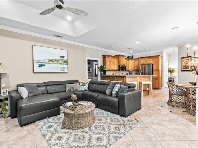 living room with ornamental molding, recessed lighting, ceiling fan, and visible vents