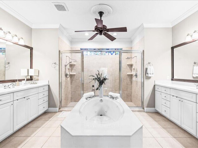 bathroom with ceiling fan, visible vents, a stall shower, a tub with jets, and two vanities