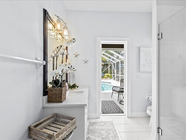 bathroom featuring toilet, tile patterned floors, baseboards, and a stall shower