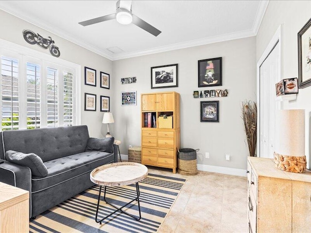 living room featuring crown molding, ceiling fan, baseboards, and tile patterned flooring