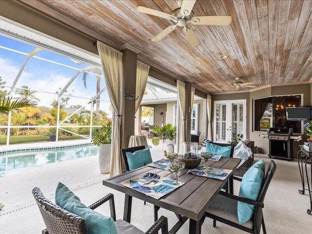 sunroom / solarium with a ceiling fan and outdoor lounge area