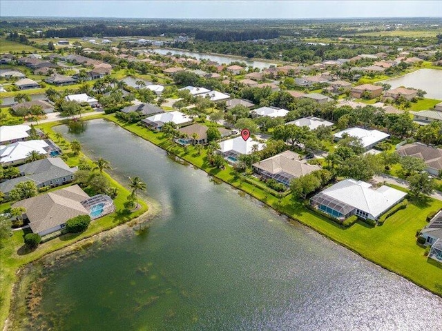 aerial view with a water view and a residential view