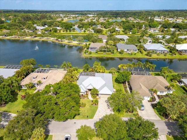 birds eye view of property featuring a water view and a residential view