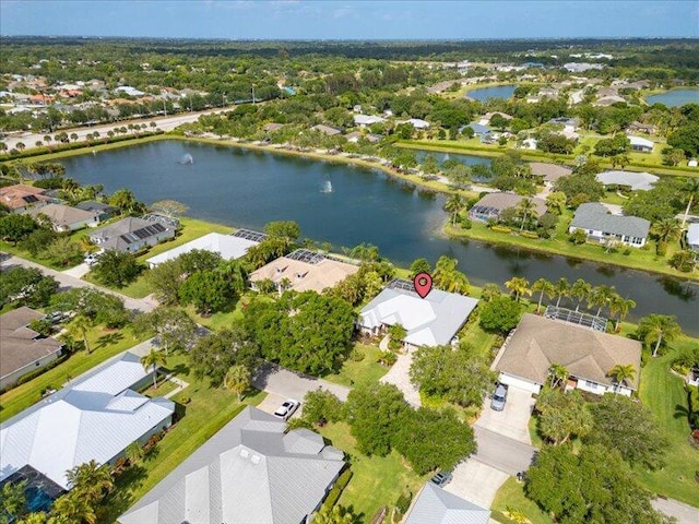 drone / aerial view with a water view and a residential view