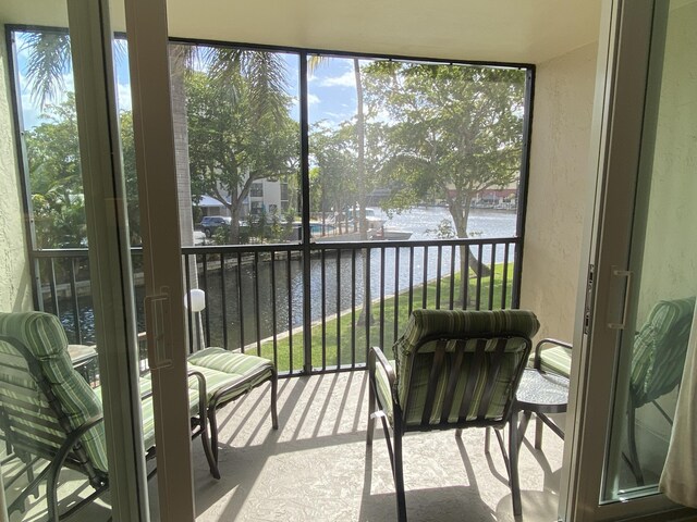 7 Royal Palm Way Unit 202, Boca Raton, FL 33432 - sunroom / solarium featuring a water view