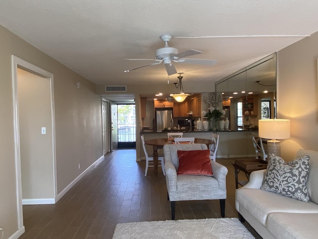 7 Royal Palm Way Unit 202, Boca Raton, FL 33432 - living area with a ceiling fan and dark wood-style flooring