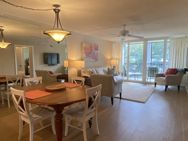 7 Royal Palm Way Unit 202, Boca Raton, FL 33432 - dining area with ceiling fan, wood finished floors, and expansive windows