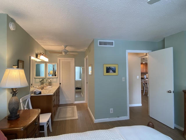 7 Royal Palm Way Unit 202, Boca Raton, FL 33432 - bedroom featuring dark wood-type flooring and a textured ceiling