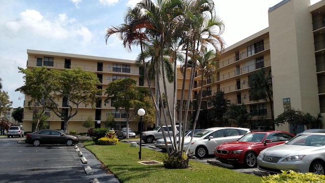 7 Royal Palm Way Unit 202, Boca Raton, FL 33432 - view of apartment building / complex with uncovered parking
