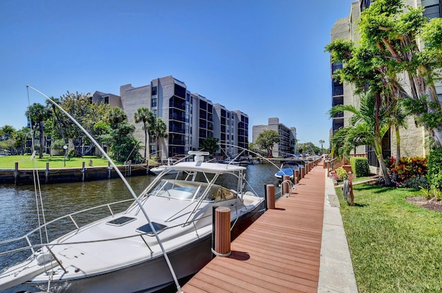 7 Royal Palm Way Unit 202, Boca Raton, FL 33432 - dock featuring a water view and a yard