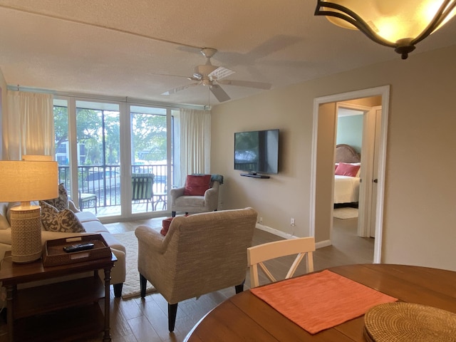 7 Royal Palm Way Unit 202, Boca Raton, FL 33432 - living room with a ceiling fan and wood finished floors