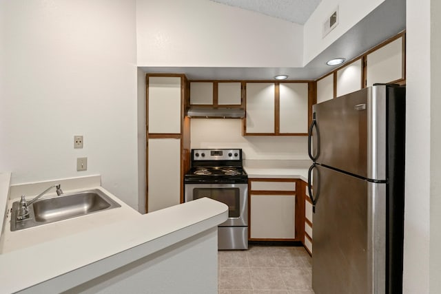 kitchen featuring stainless steel appliances, light tile patterned floors, under cabinet range hood, a sink, and visible vents