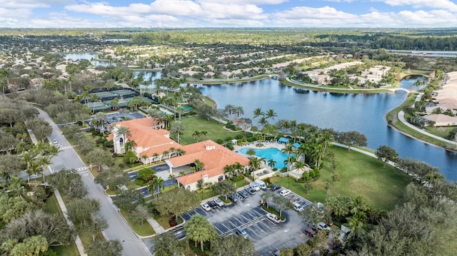 drone / aerial view with a water view and a residential view