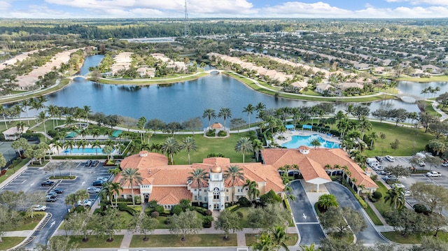 birds eye view of property featuring a water view and a residential view