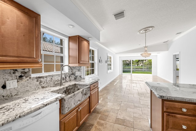 kitchen featuring stone tile flooring, brown cabinetry, ornamental molding, a sink, and dishwasher