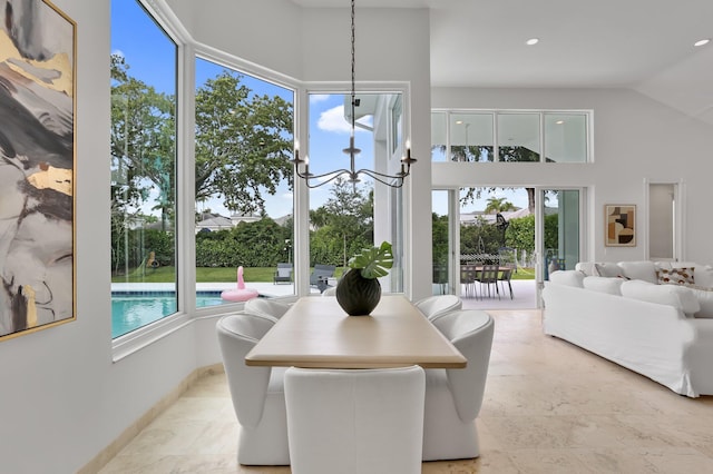 6247 NW 33rd Ave, Boca Raton, FL 33496 - dining space featuring recessed lighting, a notable chandelier, and high vaulted ceiling