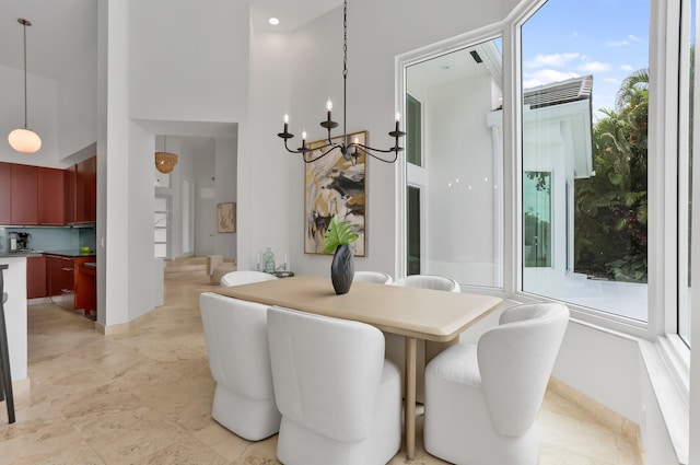 6247 NW 33rd Ave, Boca Raton, FL 33496 - dining room featuring a towering ceiling and a notable chandelier